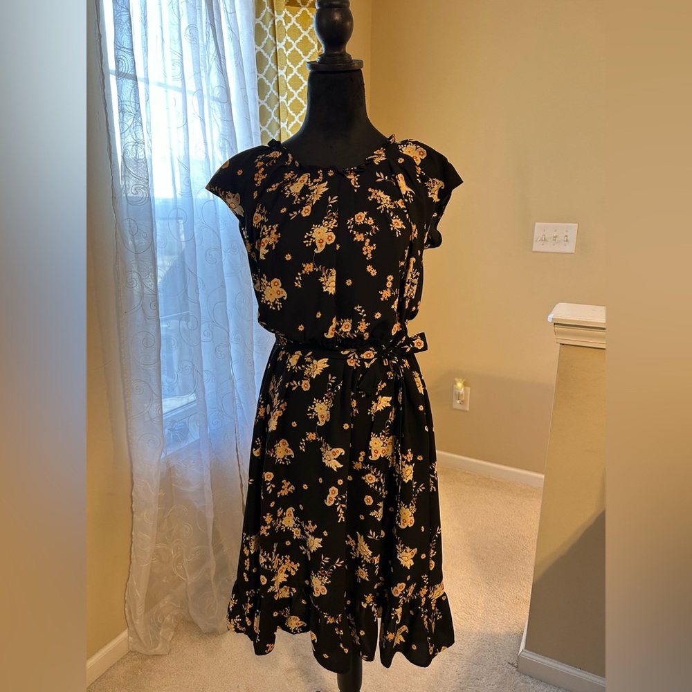 Knee length dress by Lauren Conrad. Size L.  Black with yellow flower print.